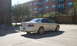 2003 Acura TL - Rear view of a white 2003 Acura TL sedan parked in a lot.