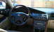 2003 Acura TL - The interior of a 2003 Acura TL is captured, highlighting the driver's side controls and dashboard features.