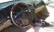 2003 Acura TL - Interior view of a 2003 Acura TL, its wood-trimmed steering wheel and dashboard details.