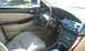 2003 Acura TL - The interior of a 2003 Acura TL features leather seats and wood trim accents.