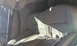 2003 Acura TL - Interior view of a car with tan leather seats and seatbelts.