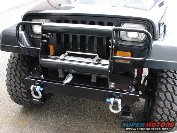 1993 Jeep YJ front with aftermarket bumper, winch, and tow hooks