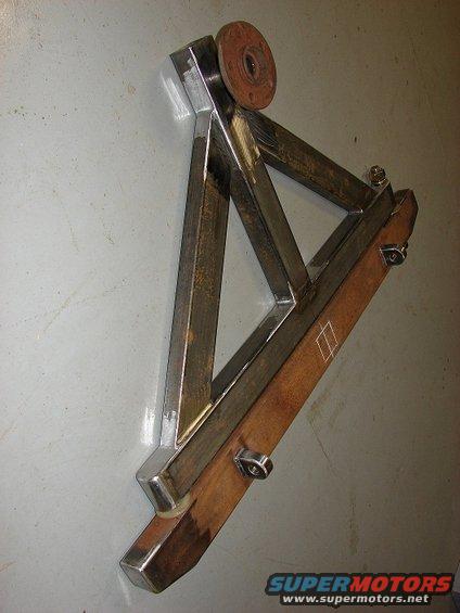 Fabricated metal bracket assembly with a rusty flange attached to the top