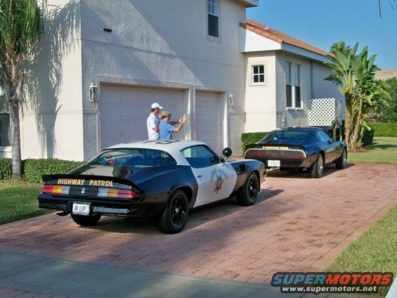 1977 Pontiac Trans Am police car with "HIGHWAY PATROL" text, parked in driveway