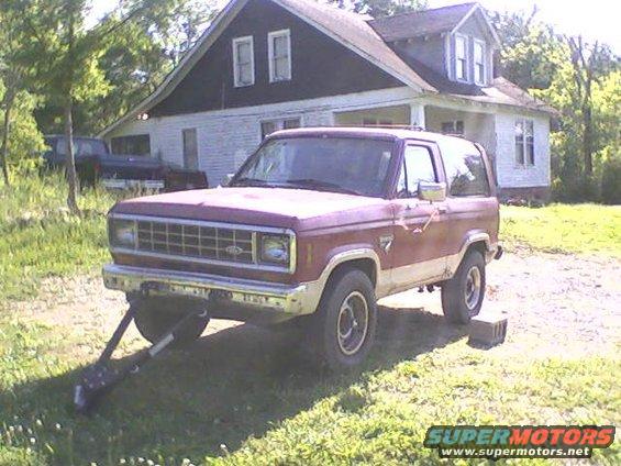Red and white 1986 Ford Bronco II, front 3/4 view