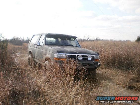 1995 Ford Bronco in a field, 3q-front view