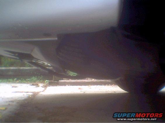 photo1.jpg And here's a really bad picture of the 3" intake hosing that i took with my cheapo camera. If you can't see it i'm sorry, but If i can, I'll get my good camera and take another. But basically what I did, was, I hacked off my intake silencer with a steak knife, and extended the regular hose down farther and scooped it forward a few degrees. My car not only performs a whole lot better now, but it sounds really cool when it hits about 5000RPM, it sounds like its supercharged.