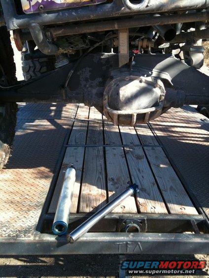 Rear axle assembly and two shock absorbers on a trailer deck