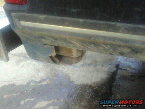 1989 Ford Bronco rear bumper with damage on the lower right corner