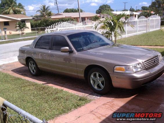 Tan 2002 Ford Crown Victoria parked on a driveway