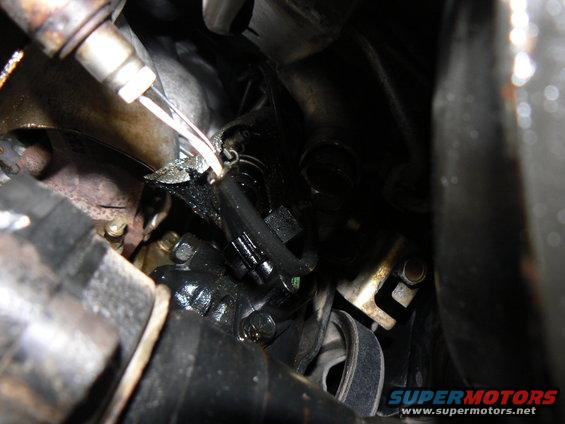 Engine components with oil leaks and frayed wiring