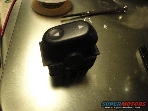 Black power window switch with up and down arrows