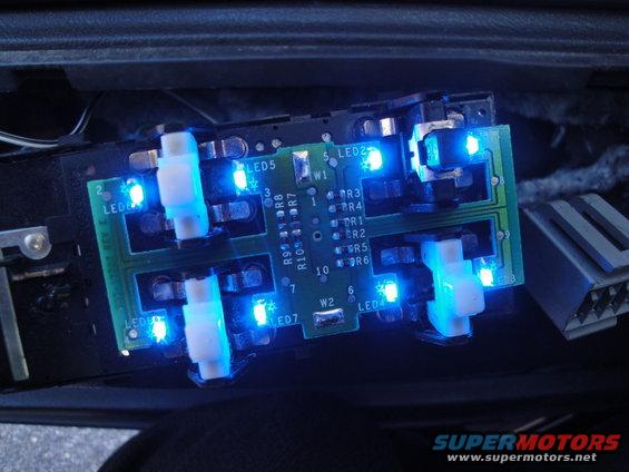 Circuit board with blue LEDs and white switches