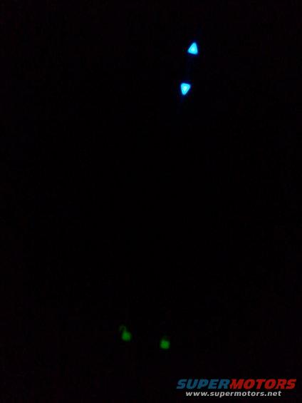 blue and green LED lights glowing in the dark
