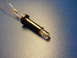 2003 Ford Crown Victoria - Close-up of an electronic component, an LED bulb with attached resistor and wires.