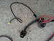 2003 Ford Crown Victoria - A close-up view of a vehicle's headlight wiring harness, showing various connectors and wires.
