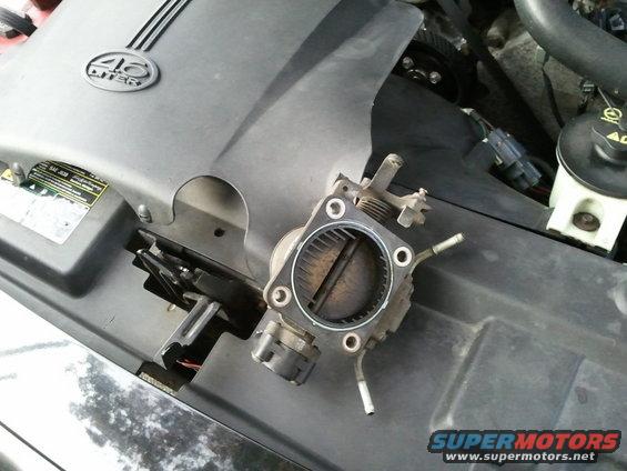 Throttle body removed from 2003 Ford Crown Victoria engine bay
