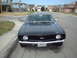 1969 Chevrolet Camaro - Front view of a black 1969 Chevrolet Camaro SS with Texas plates parked on a street.