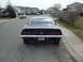 1969 Chevrolet Camaro - Rear view of a black 1969 Chevrolet Camaro SS parked on a suburban street.