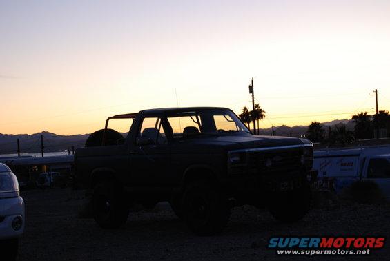 1982 Ford Bronco with removable top against sunset sky