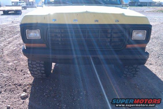 Yellow 1979 Ford Bronco front end with a black grille and square headlights