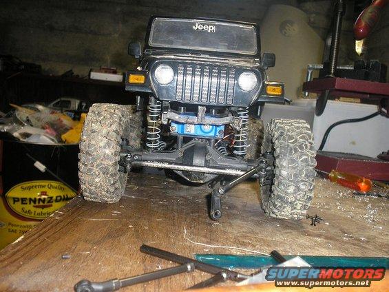 Black Jeep Wrangler toy with large tires and visible suspension components