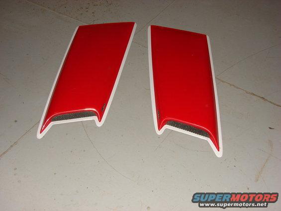 two red hood scoops with white trim and black mesh inserts