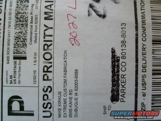 USPS Priority Mail label with handwritten date 02/02/10 and tracking number