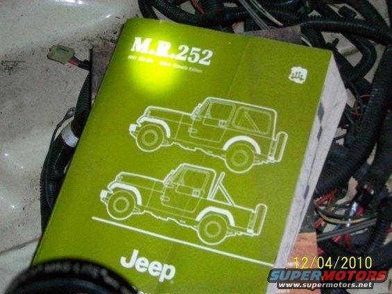Green Jeep service manual with diagrams of CJ-7 and CJ-8 models