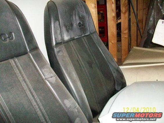 Front seats with "CJ" and "7" emblems visible. Some wear on the upholstery