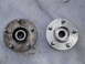 2003 Ford Taurus - A comparison of a used wheel hub assembly next to a new one.