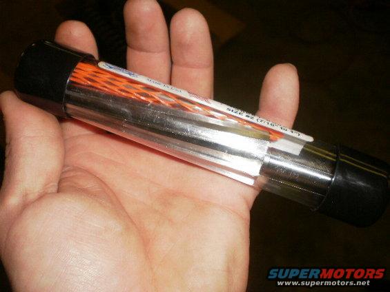 Hand holding clear tube with orange wire loom inside. Label says 'SIZE #2 (7/16" TO 1/2")'