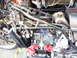 1978 Honda GL1000 - A close-up view of a disassembled motorcycle engine and frame, showing complex wiring and mechanical components.