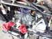 1978 Honda GL1000 - Close-up view of a motorcycle engine, with red rags placed near the carburetor area.