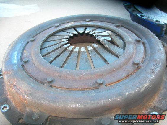Rusty clutch pressure plate with visible damage to diaphragm springs