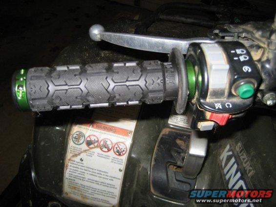 Suzuki King Quad 700 handlebar with ODI Rogue Grips and control switches