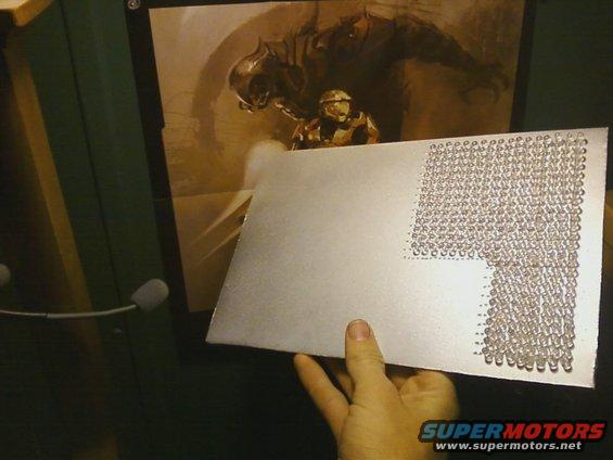 Metal plate with LEDs, held by hand