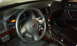 2008 Subaru Legacy - The interior of a 2008 Subaru Legacy shows the dashboard, steering wheel, and center console.