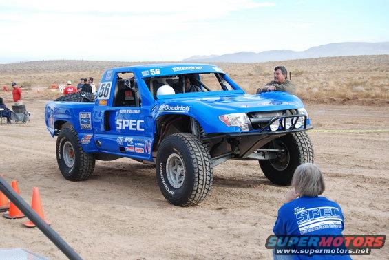 Blue off-road racing truck with number 56, BFGoodrich tires, and "SPEC" livery