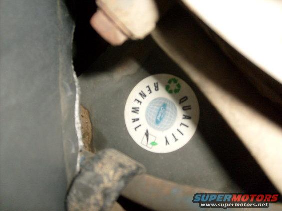 Ford quality renewal sticker on dark surface