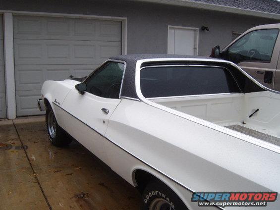 White 1973 Ford Ranchero with black vinyl top, 3/4 front view