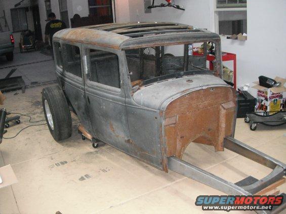 1931 Ford Model A Fordor body on a frame, weathered gray metal, wooden firewall, sunroof, on casters