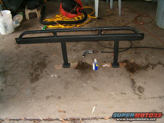 hpim0007.jpg Me drilling out the holes it 1/2 inch.  5 of the 1/2 inch bits later and I am done.