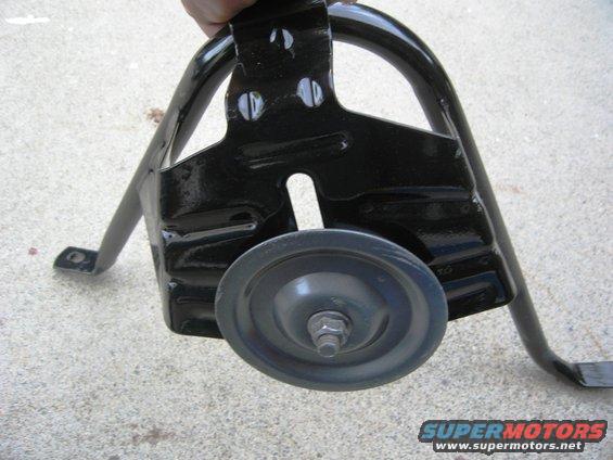 Black metal tire carrier bracket with a small wheel and bolt