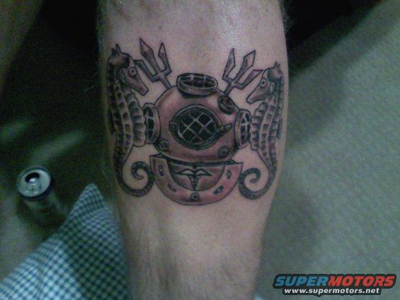 Tattoo of a vintage diving helmet with seahorses and tridents