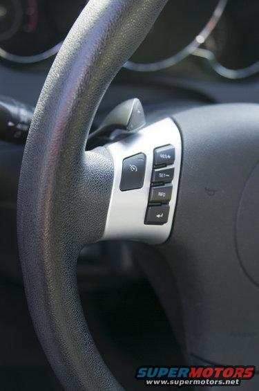 Steering wheel interior view with paddle shifters and cruise control buttons