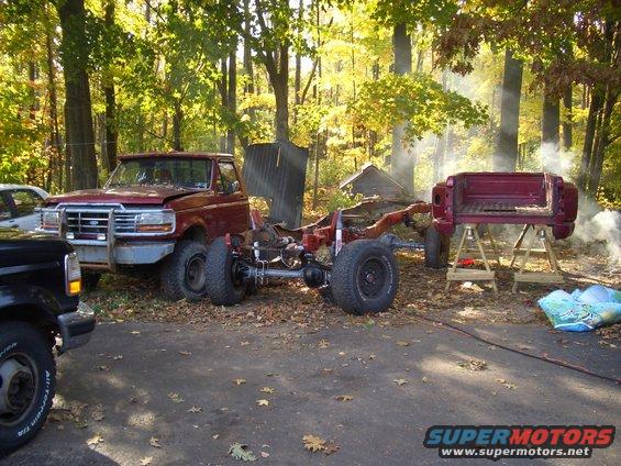 1992 Ford F-150 chassis with cab and bed removed, another truck cab visible