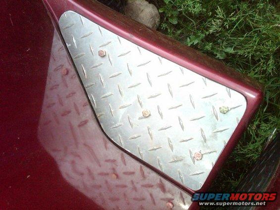 Diamond plate step on red truck fender