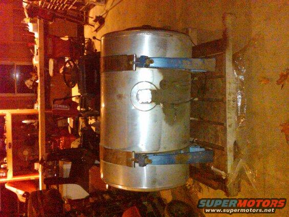 aluminum fuel tank mounted with blue straps