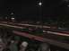 1994 Ford Bronco - Two vehicles, a monster truck and a drag car, compete on a drag strip under stadium lights.